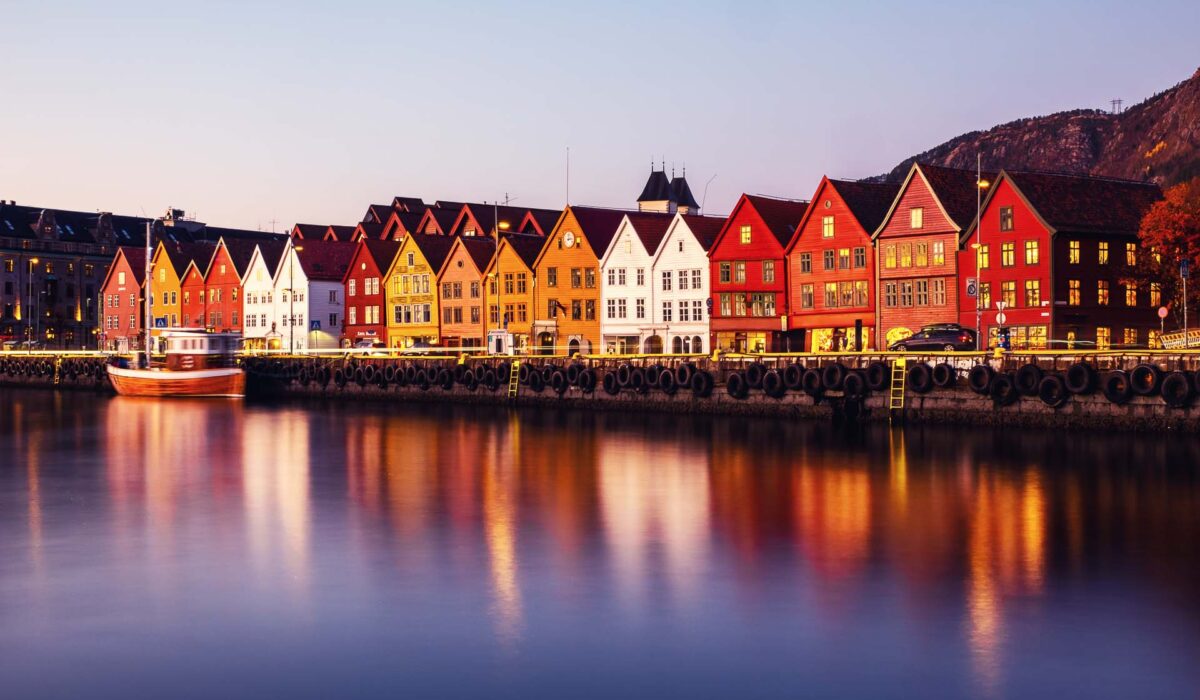 Bergen, Norway. View of harbour old town Bryggen in Bergen, Norway during the twilight. Famous illuminated landmarks at sunrise