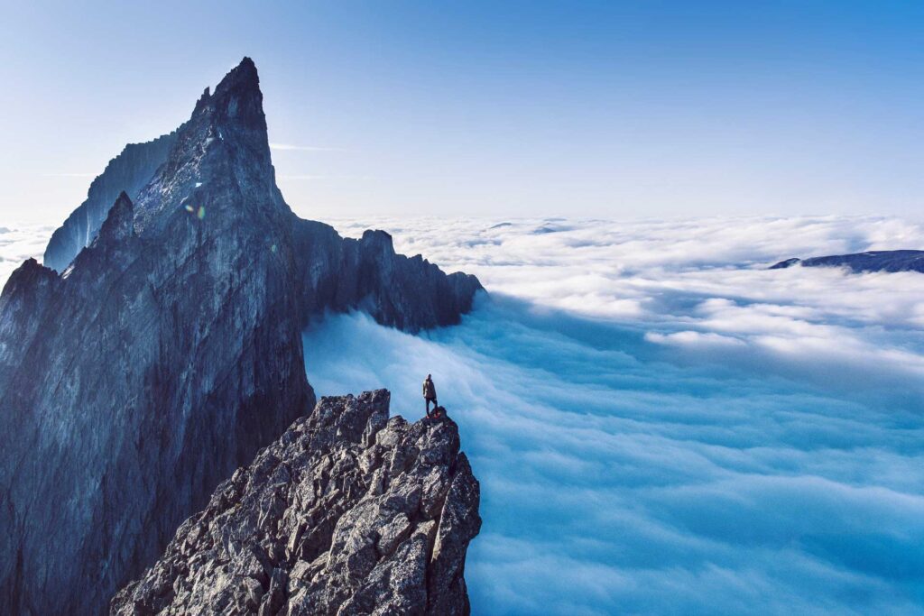 Grand wild View over Clouds on top of the Troll Wall in Norway
