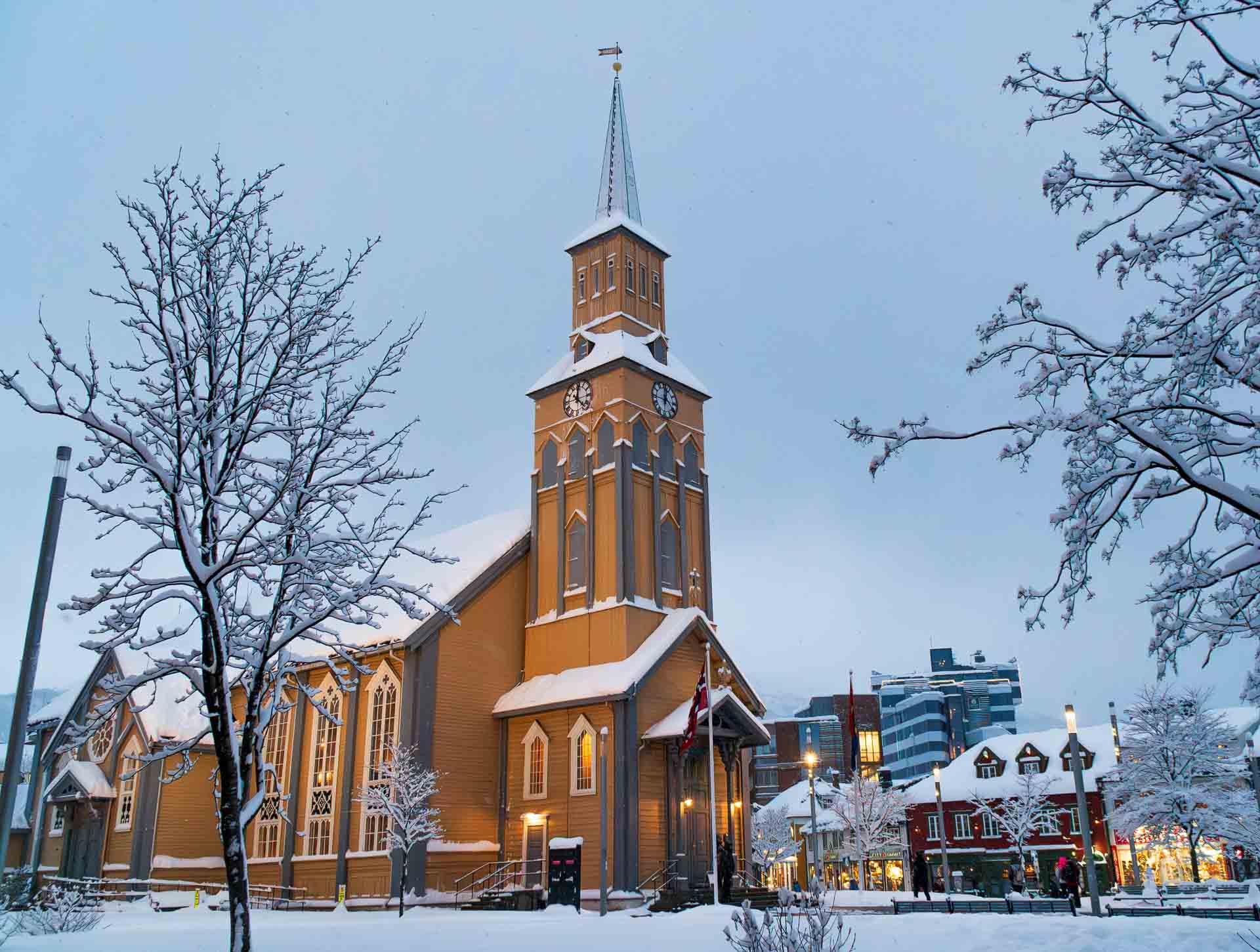 Tromsø Travel Guide 21 Tromsø cathedral, made of wood, Norway, during the winter polar night, snow, ice and cold weather.