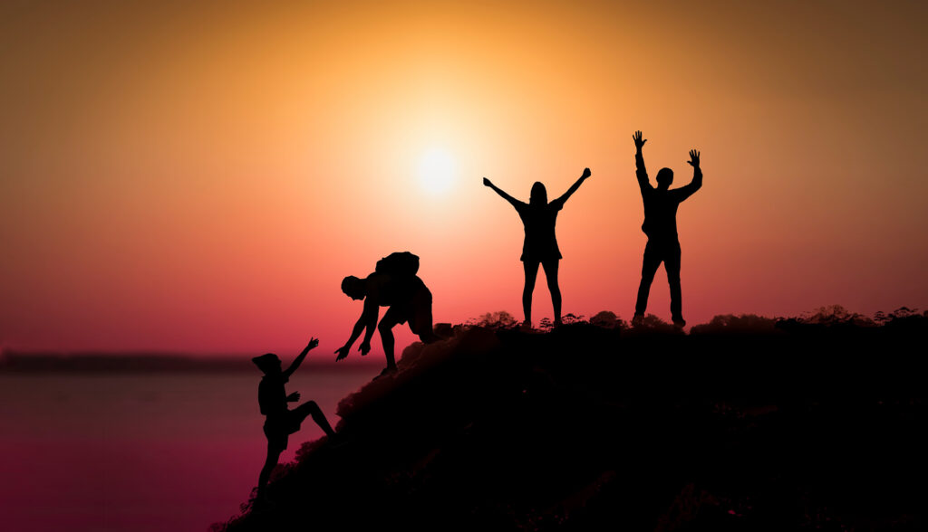 People on top of the mountain. Goal achievement, motivation concept.