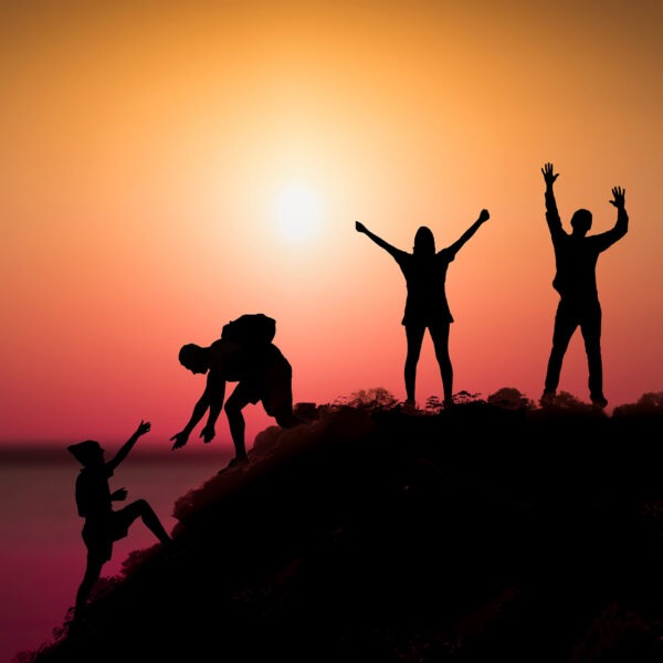 People on top of the mountain. Goal achievement, motivation concept.